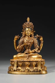 A GILT-BRONZE FOUR-ARMED AVALOKITESHVARA