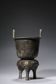 A BRONZE ARCHAIC-STYLE TRIPOD LI