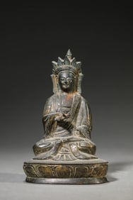 A BRONZE BUDDHA FIGURE