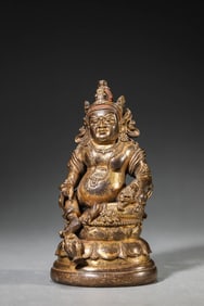 A GILT-BRONZE YELLOW JAMBHALA