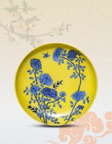 A YELLOW-GROUND BLUE AND WHITE 'BUTTERFLIES AND FLOWERS' DISH