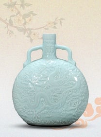 A PEA-GREEN-GLAZED 'CLOUD AND DRAGON' VASE