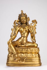 A GILT-BRONZE TARA