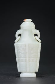 A JADE 'TAOTIE' COVERED VASE