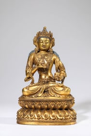 A GILT-BRONZE BUDDHA FIGURE