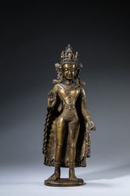 A TIBETAN TUBO STYLE ALLOY COPPER, SILVER AND COPPER-INLAID GILT-CROWNED SHAKYAMUNI BUDDHA