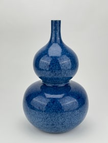 A BLUE GLAZED GOURD-SHAPED VASE