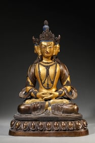 A LACQUERED AND GILT BRONZE BUDDHA FIGURE