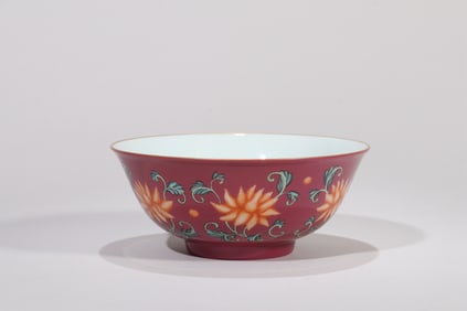 A RUBY-RED GROUND FAMILLE ROSE 'INTERLOCKING FLOWERS' BOWL