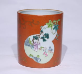 AN IRON-RED WITH GILT MEDALLION 'FIGURES' BRUSH POT