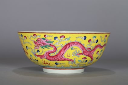 A YELLOW-GROUND FAMILLE ROSE 'DRAGONS AND PHOENIXES' LARGE BOWL
