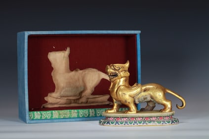 A GILT-BRONZE AUSPICIOUS BEAST