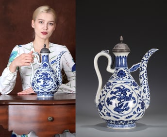 A BLUE AND WHITE 'FLOWERS AND FRUITS' EWER