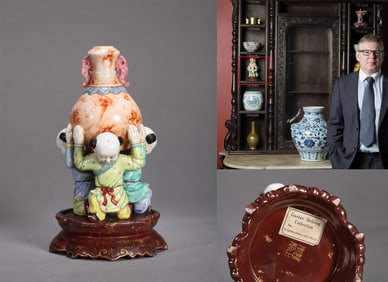 A FAMILLE ROSE PORCELAIN 'CHILD' FIGURINE