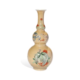 A BUFF-GROUND FAMILLE ROSE 'THREE FRUITS' GOURD-SHAPED VASE