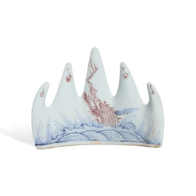 A BLUE AND WHITE WITH COPPER-RED 'CARP LEAPING THROUGH DRAGON GATE' BRUSH REST