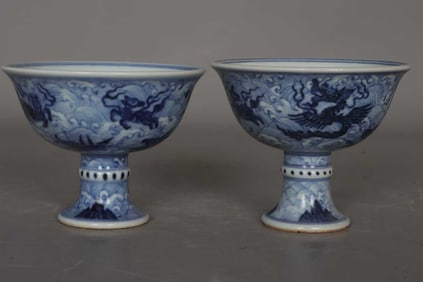 A PAIR OF BLUE AND WHITE 'SEA MONSTERS AND SANSKRIT SCRIPT' STEM CUPS