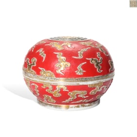 A FAMILLE ROSE RED-GROUND GILT DECORATED 'EIGHT TRIGRAMS, CLOUDS AND BATS' COVERED BOX