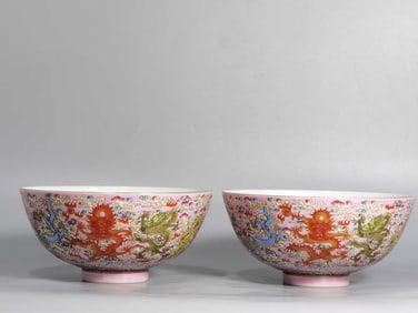 A PAIR OF PINK-GROUND FAMILLE ROSE 'DRAGON AMIDST WAVES' BOWLS