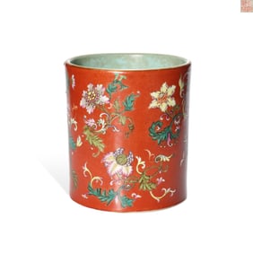 A CORAL-RED GROUND FAMILLE ROSE 'FLORAL' BRUSH POT