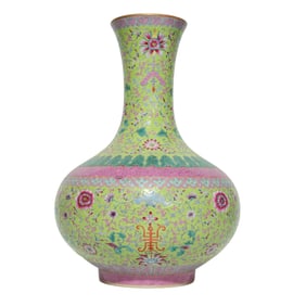 A GREEN-GROUND FAMILLE ROSE 'INTERLOCKING FLOWERS AND SHOU' VASE