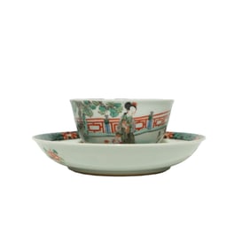 A WUCAI 'LADIES AND CHILDREN' CUP AND SAUCER SET