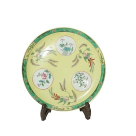 A YELLOW-GROUND FAMILLE ROSE 'FLOWERS AND BIRDS' DISH