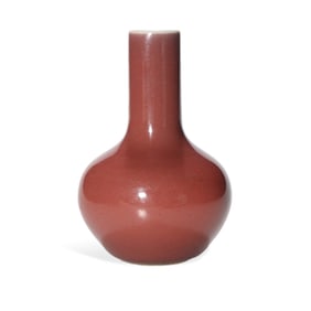 A RED-GLAZED WATER CHESTNUT-SHAPED VASE