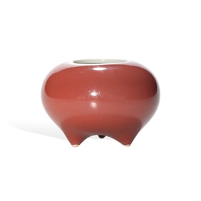 A RED-GLAZED TRIPOD WATER POT