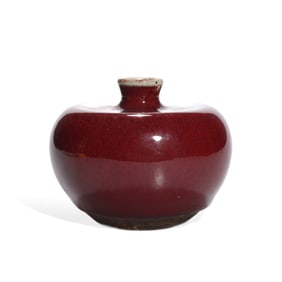 A RED-GLAZED APPLE-SHAPED VASE