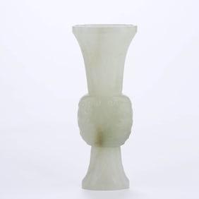 A WHITE HOTAN JADE 'BEAST MASK' MINIATURE FLOWER GOBLET