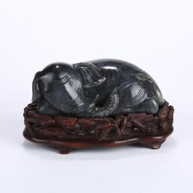 A BLACK-AND-WHITE HOTAN JADE 'ELEPHANT' FIGURE