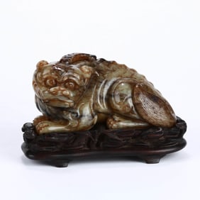A HOTAN JADE 'AUSPICIOUS BEAST' FIGURE