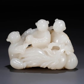 A HOTAN JADE 'BOY' FIGURE
