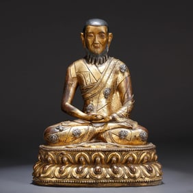 A GILT-BRONZE 'LAMA' FIGURE