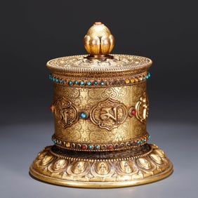 A GILT-BRONZE PRAYER WHEEL
