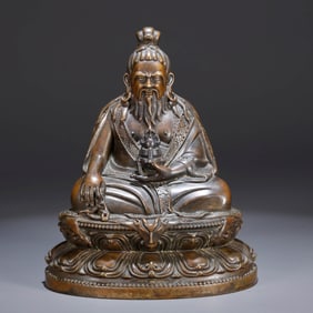 A BRONZE 'LAMA' FIGURE