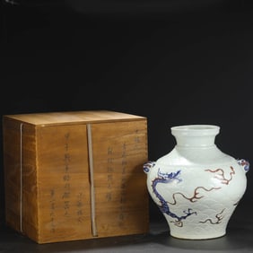 A BLUE AND WHITE WITH UNDERGLAZED RED 'DRAGON IN WAVES' JAR