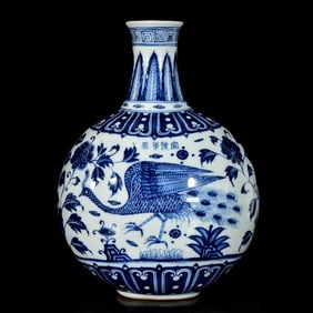 A BLUE AND WHITE 'BIRDS, PEACOCK AND PEONY' MOONFLASK