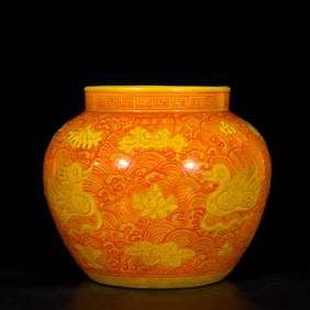 A RED-AND-YELLOW CARVED 'MANDARIN DUCKS AND LOTUS' JAR
