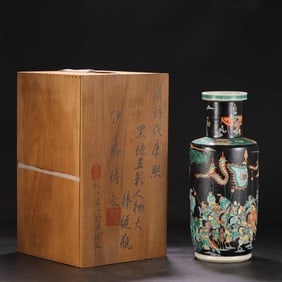 A BLACK-GROUND WUCAI 'FIGURES' ROULEAU VASE