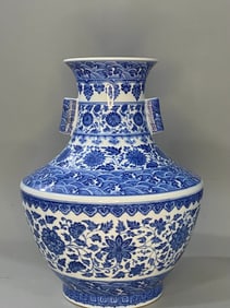 A 'INTERLOCKING LOTUS AND WAVES' TWO-HANDLED VASE