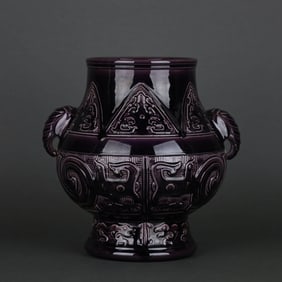 ANPURPLE-GLAZED CARVED 'TAOTIE' ELEPHANT-HANDLED VASE