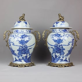 A  BLUE AND WHITE 'FIGURES' TWO-HANDLED JAR