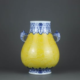 A BLUE AND WHITE YELLOW-GLAZED CARVED 'DRAGON' VASE