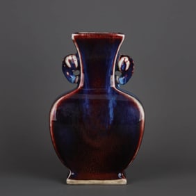 A FLAMBE-GLAZED ELEPHANT-HANDLED  VASE