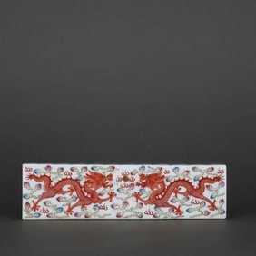 A FAMILLE ROSE WITH IRON-RED 'TWO DRAGONS CHASING PEARL' PAPERWEIGHT