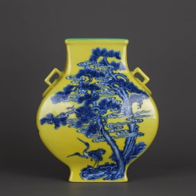 A YELLOW-GLAZED BLUE AND WHITE 'PLUM, BAMBOO, PINE AND CRANE' TWO-HANDLED  MOONFLASK
