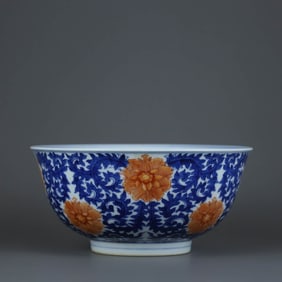 A BLUE AND WHITE WITH IRON-RED 'INTERLOCKING FLOWERS' BOWL