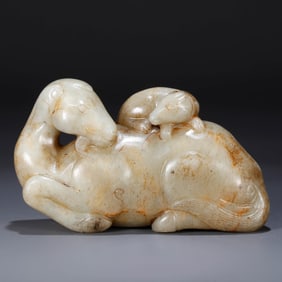 A HETIAN JADE 'AUSPICIOUS BEAST' CARVING